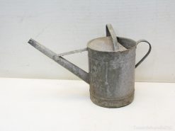 Vintage metal watering can, perfectly blending rustic charm and functionality for your garden.