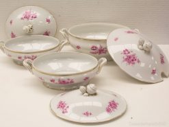 Elegant porcelain serving dishes with pink floral patterns and gold trim for stylish dining.