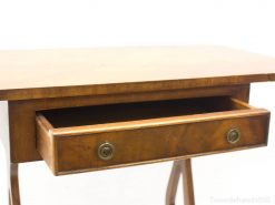 Elegant wooden table with drawer, perfect for adding warmth and style to any interior.