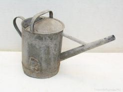 Nostalgic vintage metal watering can, perfect for precise watering and adding charm to gardens.