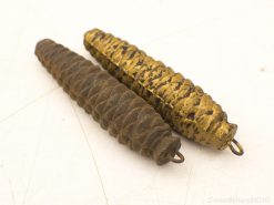 Vintage pine cone weights in rustic iron and polished brass for elegant home decor.