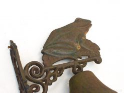 Whimsical vintage cast iron frog decoration with elegant scrollwork, ideal for gardens and nature lovers.