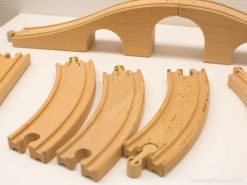 Vintage wooden train tracks for creative play and skill development in children.