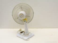 Charming vintage white desk fan with adjustable angle, perfect for stylish cooling and nostalgic decor.