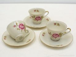 Elegant vintage porcelain tea cups with rose patterns for upscale tea gatherings and collectors.