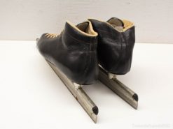 Elegant vintage black leather ice skates size 44, perfect for skating enthusiasts.