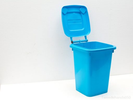 Modern blue trash bin with an open lid, ideal for stylish and efficient waste management.