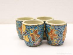 Vibrantly decorated handmade ceramic flower cups, perfect for decor or unique gifts.