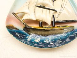 Pastel sailing ship decor with detailed waves, perfect for maritime-themed home decoration.