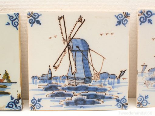 Elegant Delft tile featuring a serene blue windmill in a classic Dutch landscape.