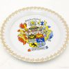 Friesland decorative plate with vibrant coat of arms and elegant gold trim celebrating heritage.