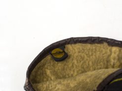 Stylish GELMO fleece hat in dark brown with cozy beige lining for cold weather comfort.