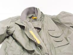 Durable olive green winter jacket with practical pockets and a cozy gray collar for outdoor activities.