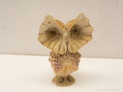 Charming seashell owl figurine, a creative vintage decor piece for nature enthusiasts.