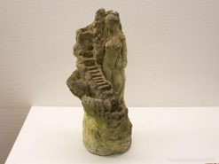 Elegant woman sculpture with stairs, embodying growth and natures harmony for garden decor.