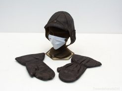 Vintage aviator helmet and mittens with a modern mask, merging aviation history and health awareness.