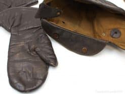 Vintage brown leather mittens with pouch, perfect for stylish warmth in cold weather.