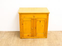 Bright yellow cabinet with drawer and doors, perfect for stylish and functional home storage.