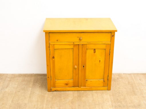 Bright yellow cabinet with drawer and doors, perfect for stylish and functional home storage.