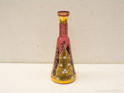 Elegant vintage pink and gold vase with floral patterns, perfect for luxurious home decor.