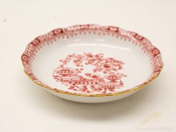 Elegant porcelain dish with intricate red designs and gold accents, perfect for display or dining.