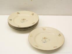 Charming vintage porcelain plates with floral designs for elegant dining and special occasions.