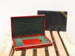 Elegant vintage calculator set in a luxurious red wooden case with a matching pen.