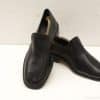 Elegant black leather slip-on shoes for men, ideal for formal and casual occasions.