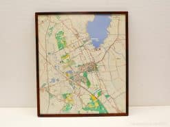 Elegant framed map featuring vibrant landscapes, water bodies, and urban areas in harmonious detail.