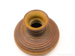 Elegant brown and gold artisan vase, perfect for decor or displaying flowers.