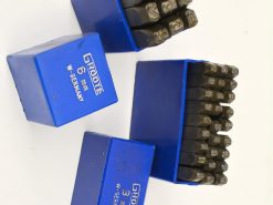 Quality 6mm and 3mm metal stamps in durable blue boxes for precision engraving tasks.