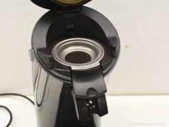 Sleek black coffee maker with a stainless steel filter, ideal for stylish and functional kitchens.