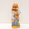 Cheerful garden gnome with a shovel, perfect for adding charm to outdoor spaces.