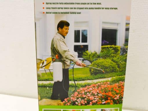 Man using a 5-liter pressure sprayer in a vibrant, well-maintained garden.