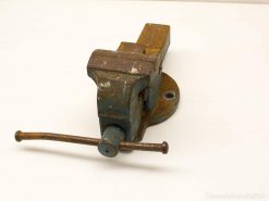 Vintage blue bench vise, sturdy and reliable for woodworking and metalworking projects.