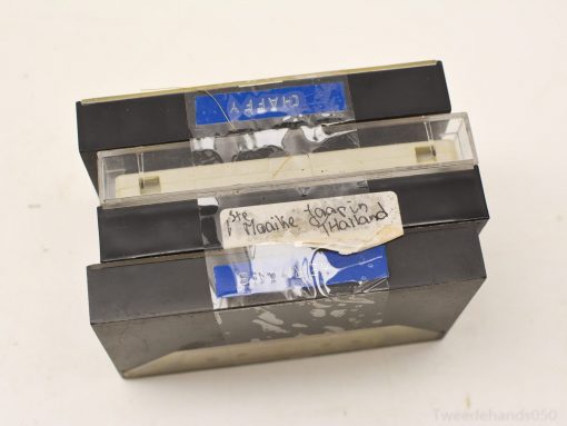 Vintage cassette tapes with worn labels, featuring unique recordings and memories from a bygone era.