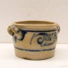 Charming vintage ceramic pot with intricate blue design and functional handles for decor or use.