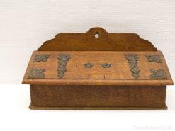 Elegant antique wooden box with ornate metal details for stylish storage and decoration.