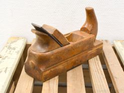 Vintage wooden hand plane with rich patina, perfect for woodworking and craftsmanship enthusiasts.