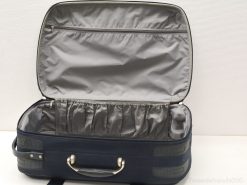 Navy blue vintage suitcase with gray interior, featuring organized storage for stylish travel.