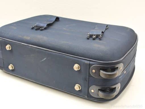 Classic navy blue suitcase with wheels, robust metal clasps, and a charming vintage appeal.