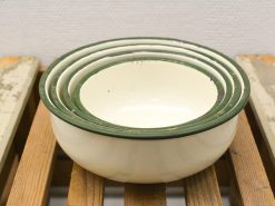 Timeless vintage nesting bowls with green rims, ideal for mixing and serving in your kitchen.