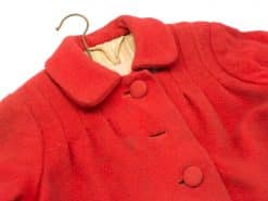 Vintage red coat for girls, offering warmth and timeless style for chilly days.