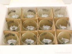 Vintage set of 12 glass tumblers in elegant storage box, perfect for collectors and special occasions.