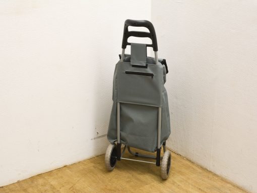 Gray shopping cart featuring ergonomic handle, ample storage, and smooth-rolling wheels for convenient shopping.