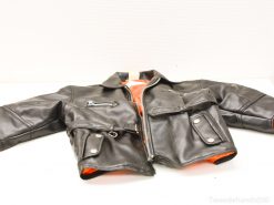 Stylish black leather kids jacket with vibrant orange lining and silver hardware accents.