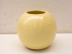 Modern yellow ceramic vase with textured ridges, perfect for decorative floral arrangements.