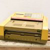 Retro Canon FAX-220: A nostalgic beige and yellow fax machine from the late 20th century.