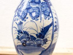 Elegant blue and white porcelain vase with hand-painted floral motifs, reflecting Chinese artistry.