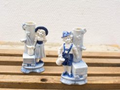 Charming ceramic figurine vases of a boy and girl, perfect for adding nostalgic charm.